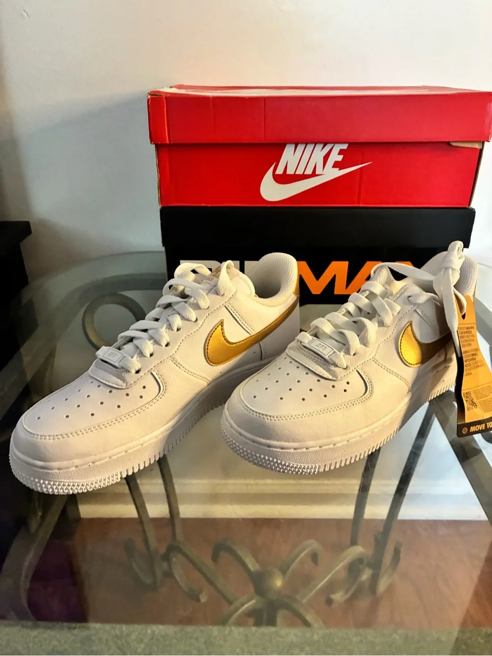 Nike White Sneakers with Gold Swoosh